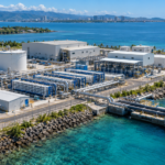 AI-generated aerial illustration of a coastal desalination plant, showing water treatment facilities and seawater intake infrastructure.